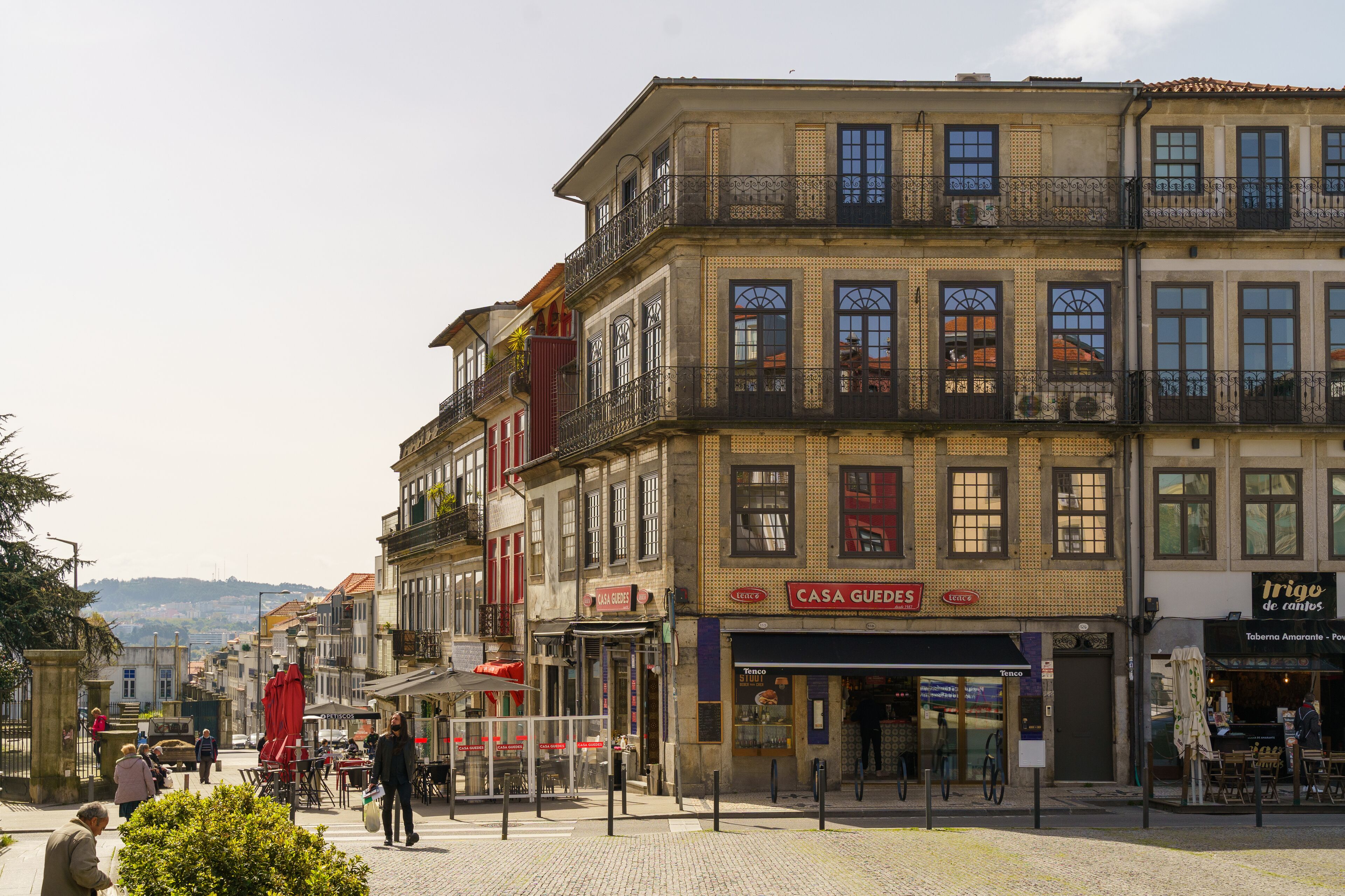 A street with buildings, including a cafe and a restaurant.