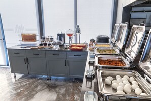 A buffet setup with various food items and utensils. - Csk The Halich Port Istanbul (Istanbul)