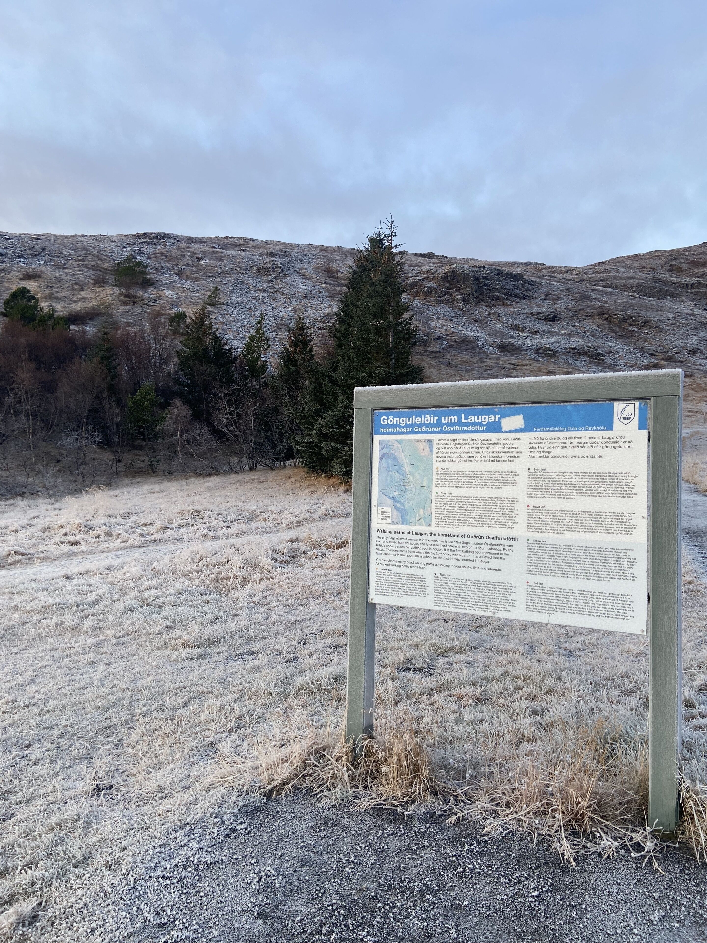 A sign with information about walking paths at Laugar, the homeland of Guðríður Óvinsdóttir.