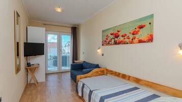Classic Apartment (A2) | Living area | 100-cm flat-screen TV with satellite channels, TV