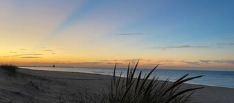 Dune Sky is a 2 Bedroom/2 Full Bath upper level duplex unit just a 2 minute walk to Lake Michigan