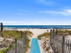 A beach path leading to the sea with beach umbrellas and chairs. - Sugar Beach-C16 Unique in the best way. Just updated be first to enjoy upgrades. (Panama City)