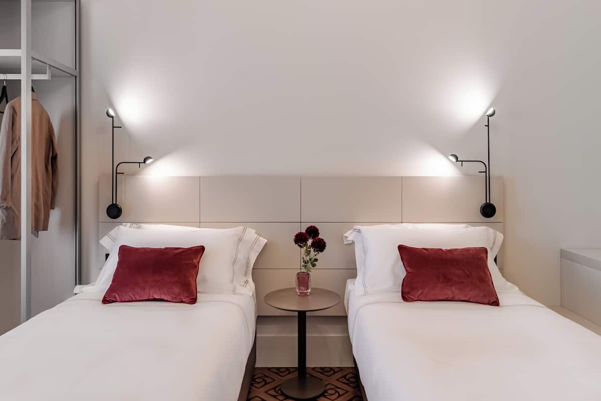 Double or Twin Room | Minibar, in-room safe, individually decorated, individually furnished