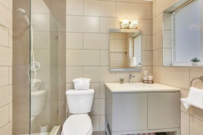 Combined shower/tub, hair dryer, towels, toilet paper