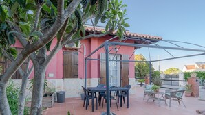 A patio with outdoor furniture, a pergola, and potted plants. - "Villa Angela" with Terrace, Shared Garden & Wi-Fi (Augusta)