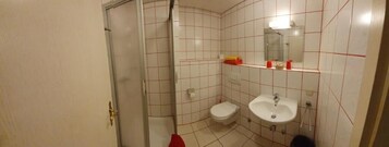 Shower, rainfall showerhead, towels, soap