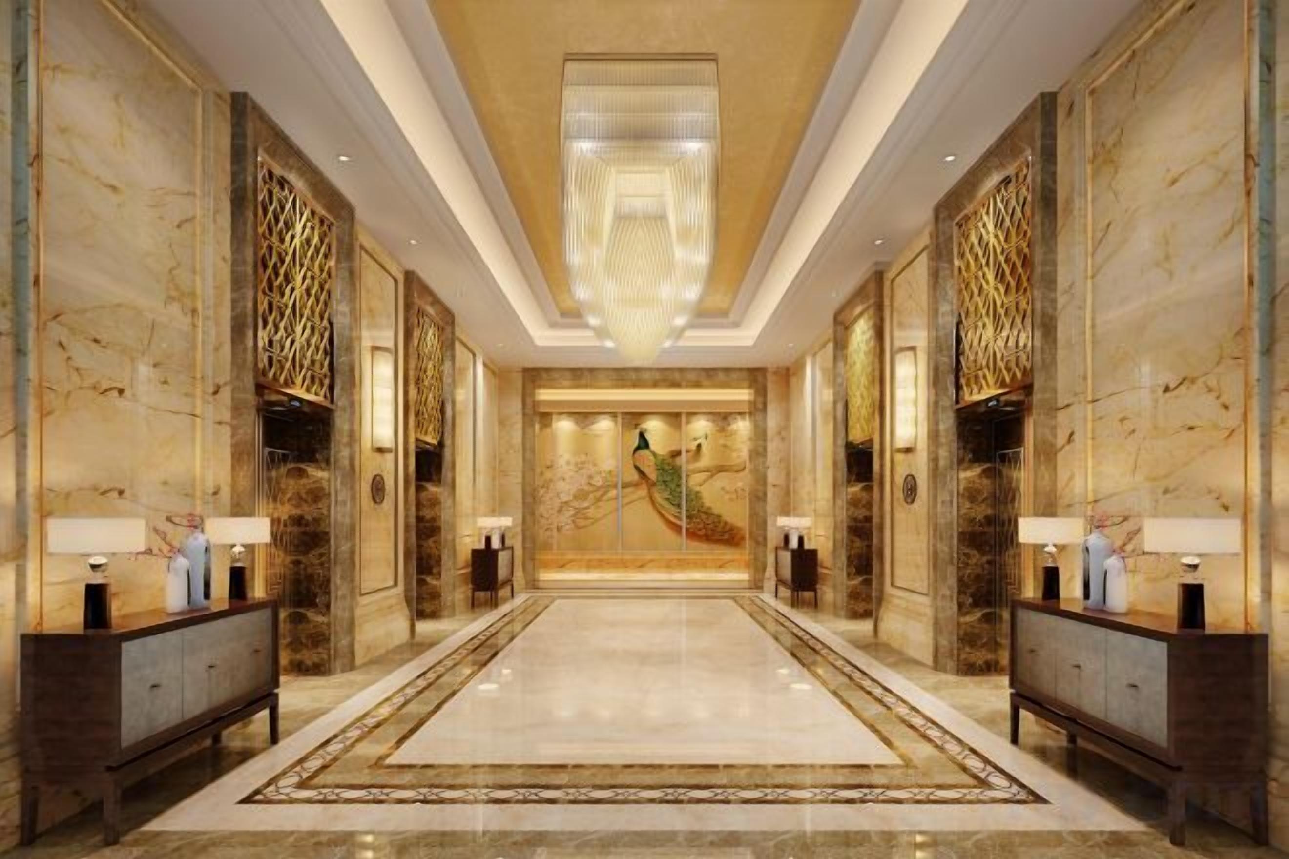 Vestíbulo de hotel con piso de mármol, una araña central y un mural grande en la pared.
