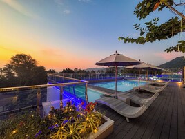 2 outdoor pools, open 7:00 AM to 9:00 PM, pool umbrellas, sun loungers