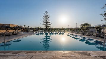 2 outdoor pools, open 10:00 AM to 6:00 PM, pool umbrellas, pool loungers