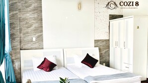A modern hotel room with a two-bed setup, marble wall, and a visible COZI 8 logo. - Cozi 8 Apartment (Thành phố Hồ Chí Minh)