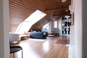 Classic Apartment | Living area | 36-inch TV with cable channels - 2ndhomes 2-Story Penthouse w Balcony (Helsinki)