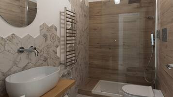 Een moderne badkamer met een groot ovaal wastafel, een badkuip, een douche met glazen wanden en een houten wastafelmeubel.