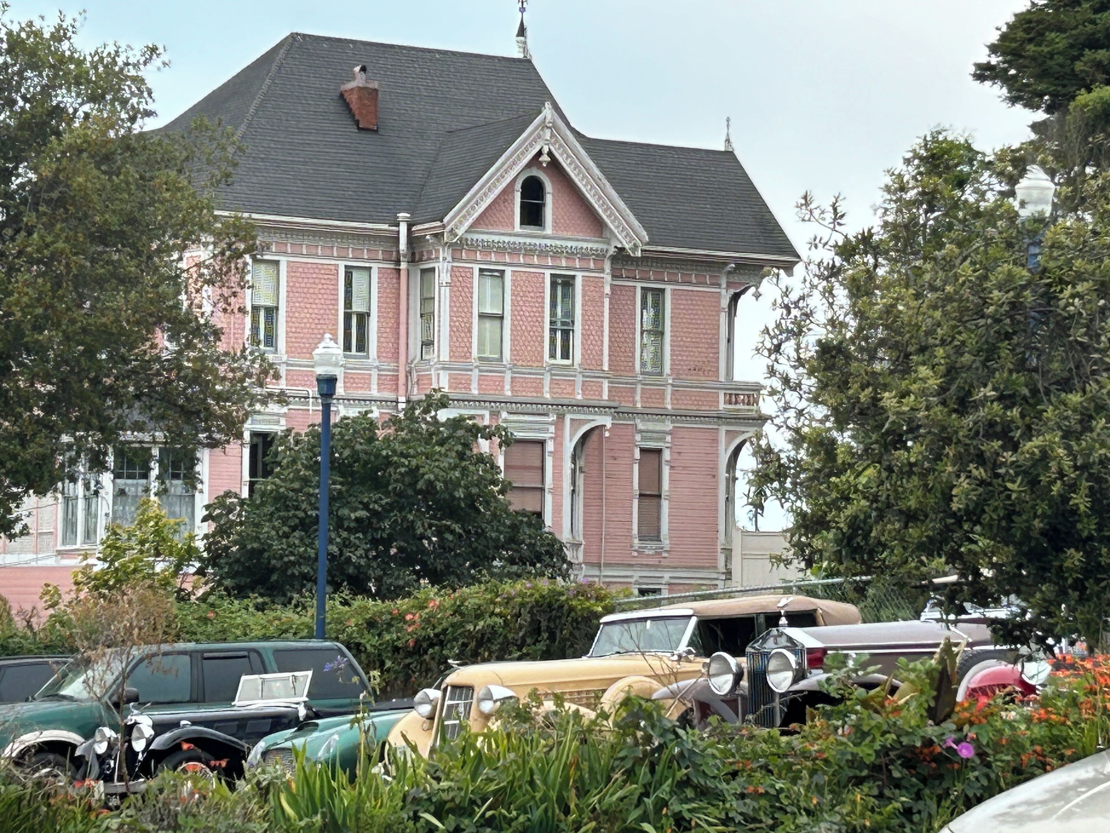 A large, historic house with a prominent gabled roof and ornate trim.