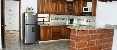 Microwave, oven, coffee/tea maker, cookware/dishes/utensils