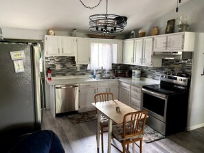 Fridge, microwave, oven, stovetop - Remodeled Lake Erie Cottage w/ Sunroom, Patio & Open Space (Lakeside Marblehead)