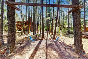 Property grounds - Tranquil forest cabin with private hot tub, firepit, play area, enclosed yard (Pinetop)
