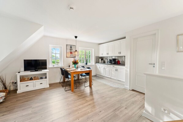 Fridge, stovetop, dishwasher, coffee/tea maker