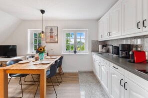 Fridge, stovetop, dishwasher, coffee/tea maker