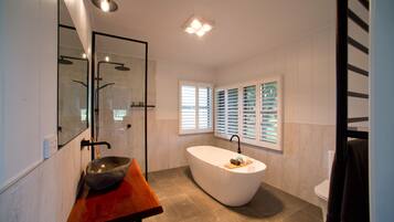 Bathtub, hair dryer, towels, soap