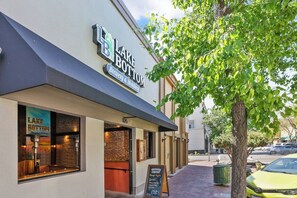 A building with a sign reading 'Lake Bottom Brewery & Distillery' and a visible entrance. - Midtown Loft 301 on Main St DT Visalia (Visalia)