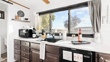 Coffee/tea maker, microwave, cookware/dishes/utensils