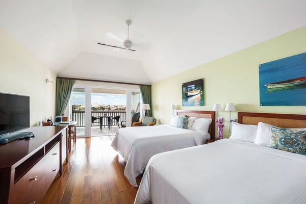 Stretch out in a spacious double-queen room with balcony views.