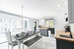 Enjoy meals in the kitchen with a central island and dining area for four.