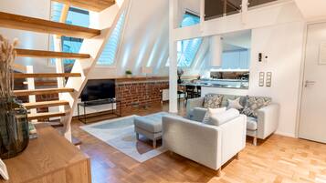 Exclusive Apartment | Living area | 36-inch flat-screen TV with cable channels, TV