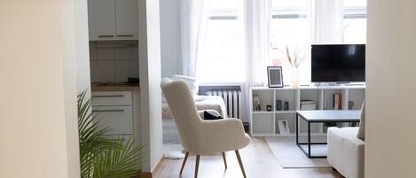 City Apartment | Living area | 36-inch TV with cable channels