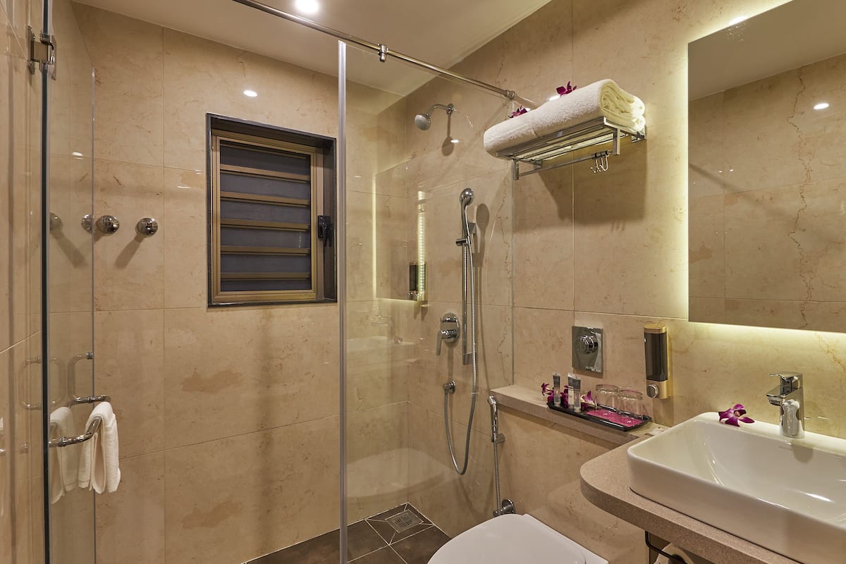 Bathroom | Shower, rainfall showerhead, hair dryer, slippers