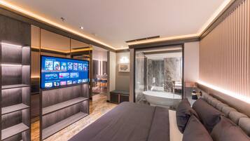 Kamar Eksekutif | Seprai premium, isi minibar gratis, brankas, dan meja kerja