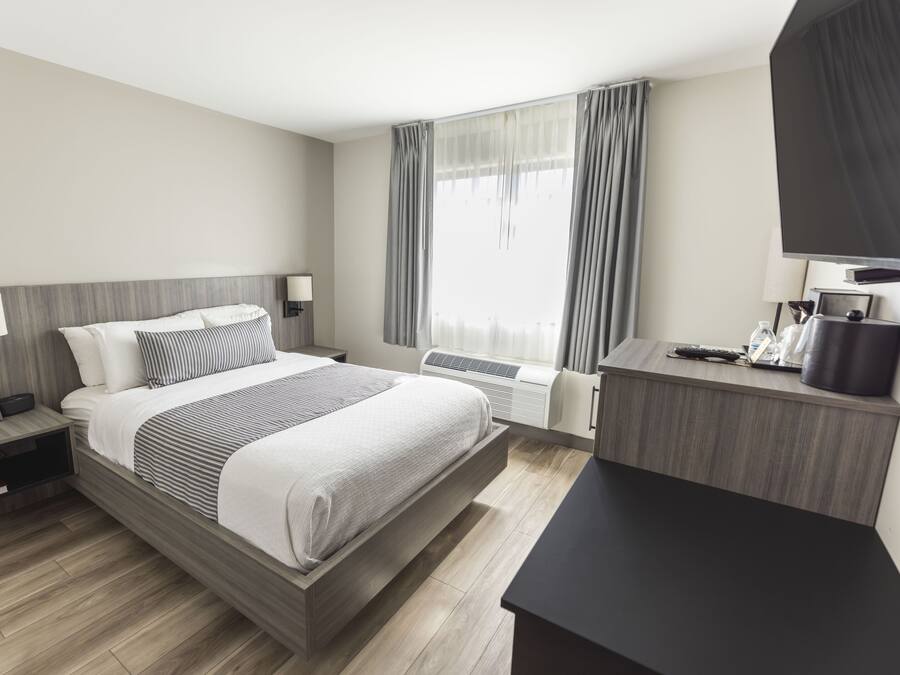Premium bedding, down comforters, pillowtop beds, in-room safe