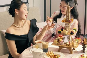 A table with a tiered dessert display, a teapot, and a cup of tea. - Le Méridien Seoul, Myeongdong (Seoul)