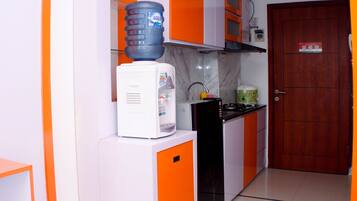 Studio | Private kitchen | Fridge, stovetop, cookware/dishes/utensils, dining tables