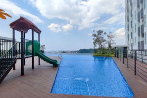 Outdoor pool - Comfortable And Modern 1Br Without Living Room At Amartha View Apartment (Semarang)