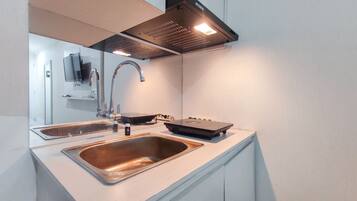 Studio | Private kitchen | Fridge, stovetop, cookware/dishes/utensils, dining table