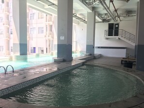 Outdoor pool - Classic Studio Room Apartment at Oxford Jatinangor (Cileunyi)