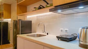 Apartemen, 2 kamar tidur | Dapur pribadi | Lemari es, kompor, peralatan masak/sendok-piring, dan meja makan