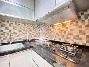 Private kitchen - Cozy Stay And Serene Designed 2Br At Braga City Walk Apartment (Bandung)