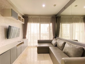 Living area - Cozy Stay And Serene Designed 2Br At Braga City Walk Apartment (Bandung)