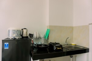 Estúdio | Cozinha privada | Geladeira, cooktop, talheres/pratos/utensílios de cozinha