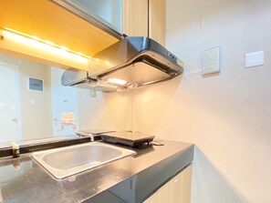 Apartment, 2 Bedrooms | Private kitchen | Fridge, stovetop, cookware/dishes/utensils, dining tables