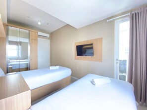 Apartamento, 2 quartos | 2 quartos, individualmente decorados, individualmente mobiliados