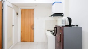 Apartment, 2 Bedrooms | Private kitchen | Fridge, stovetop, cookware/dishes/utensils, dining tables - Homey 2Br At Puncak Permai Apartment (Surabaya)