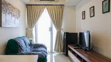 Apartment, 1 Bedroom | Living area | TV