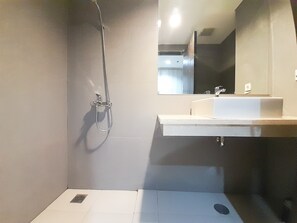Studio | Bathroom | Shower, free toiletries, towels - New Studio At Patraland Amarta Apartment (Ngaglik)