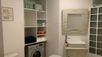 Shower, towels, soap, toilet paper