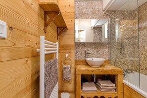 Bathtub, hair dryer, towels