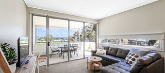 Relax and unwind in this stylish coastal unit at the 4.5-star Silverwater Resort