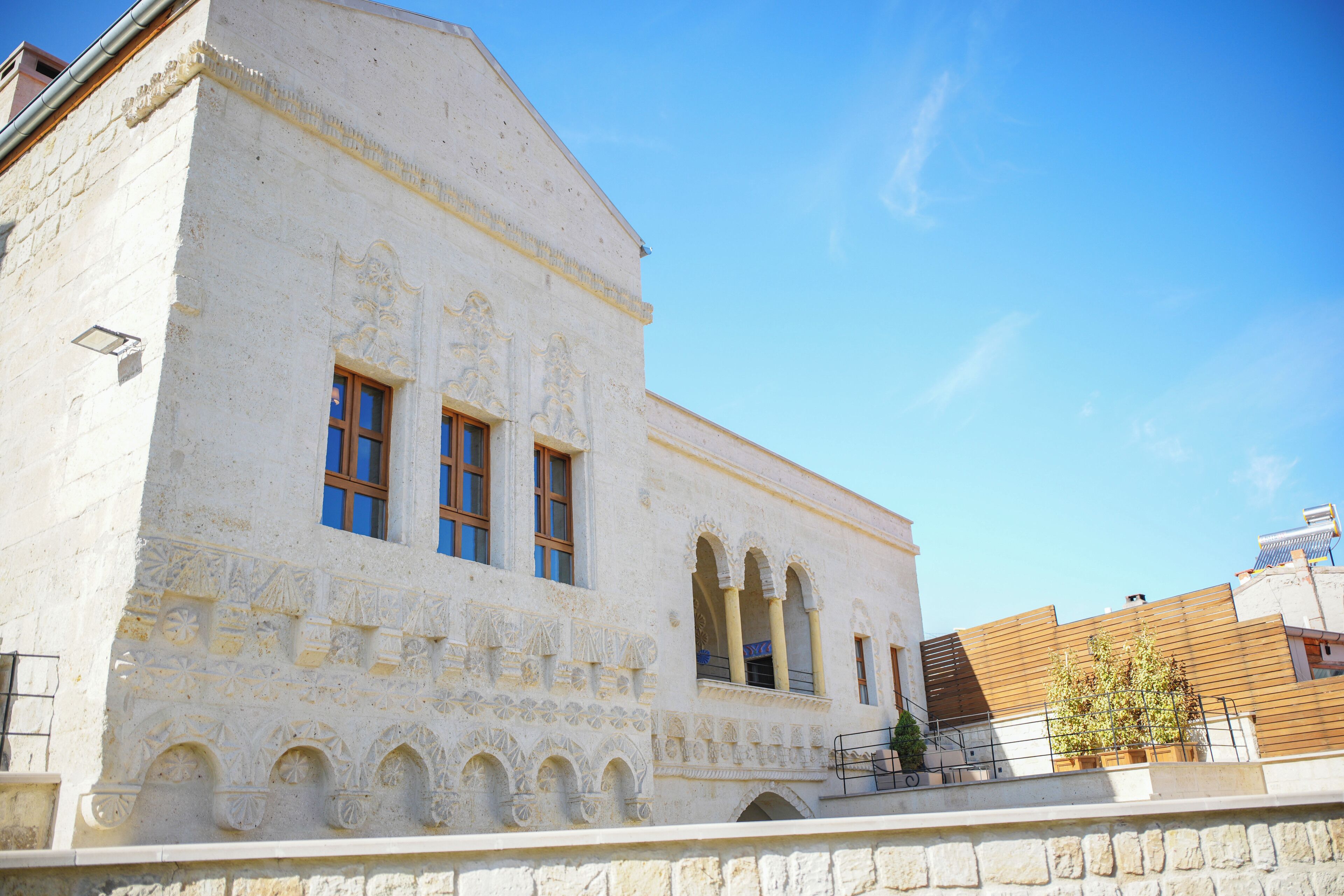 A building with arched windows and a stone facade.